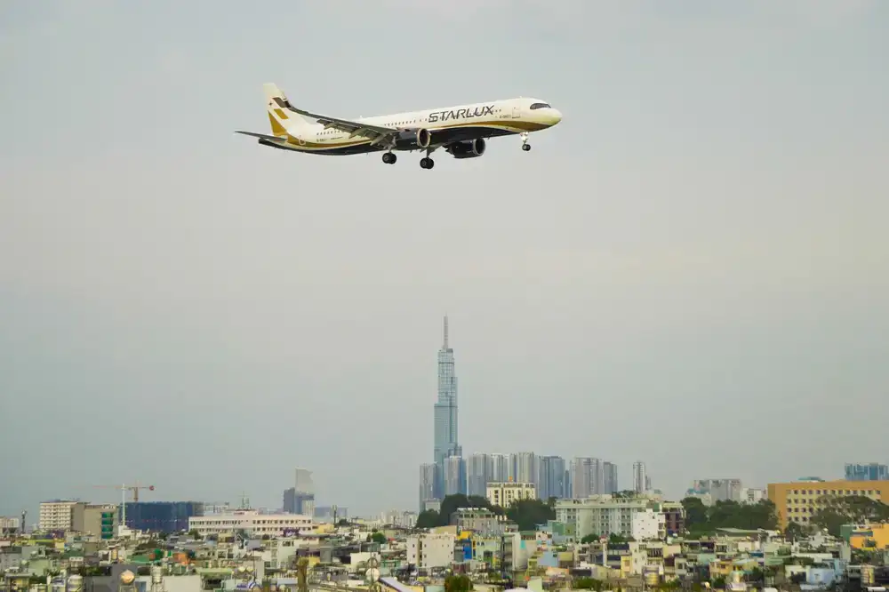 Heavy aircraft banking over city