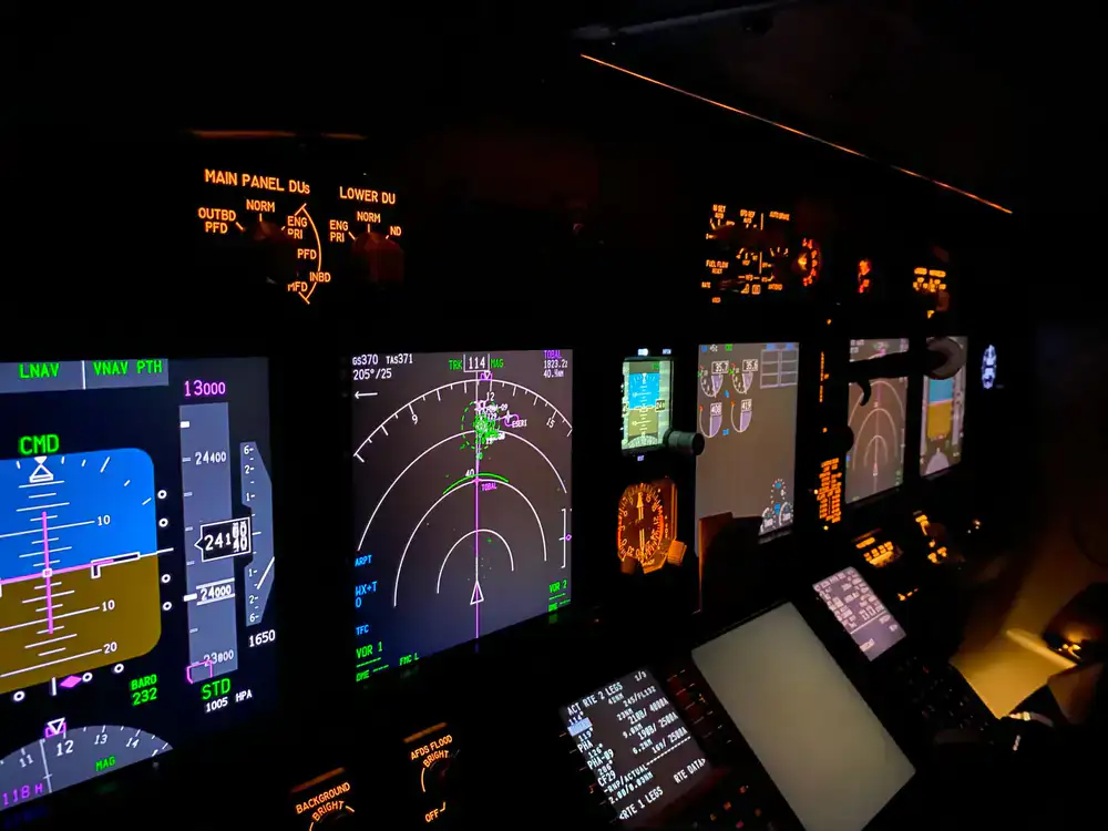 Pilot reviewing verified flight data on a simulator monitor